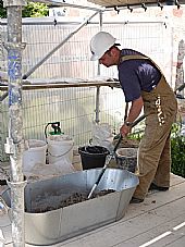Andrew Newcombe mixing mortar